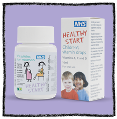 Healthy Start Vitamins - Photograph against purple background of a white container with healthy start vitamins  and vitamin drops on the label.